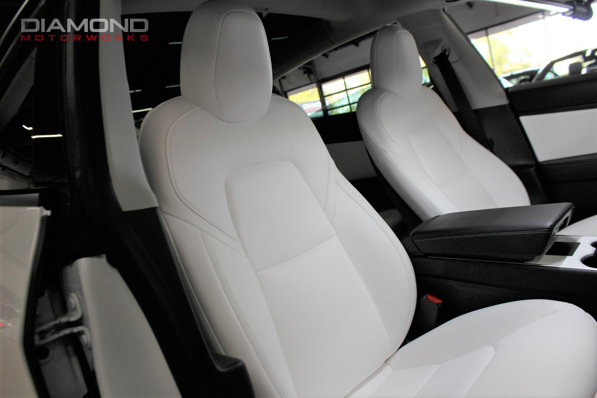 New Tesla Model 3 Performance Highland stuns with white bucket seats